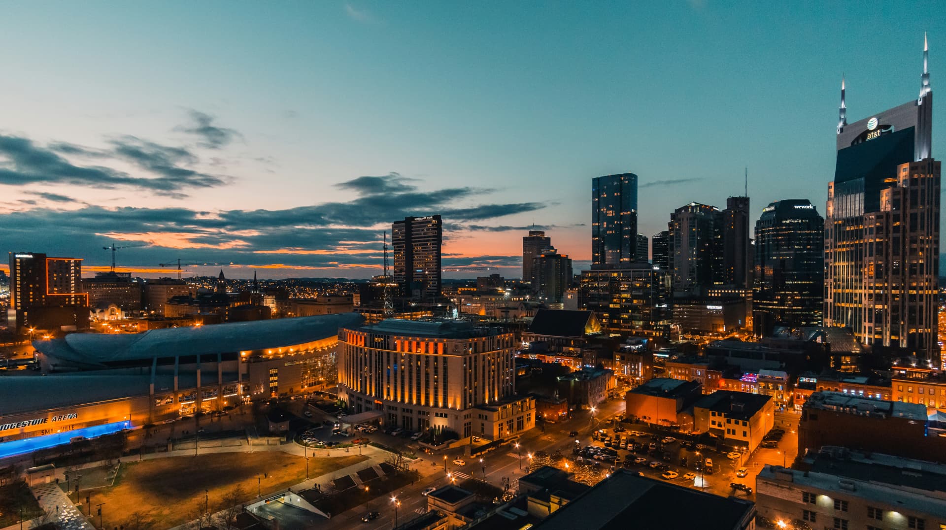 Downtown Nashville skyline lit up at dusk